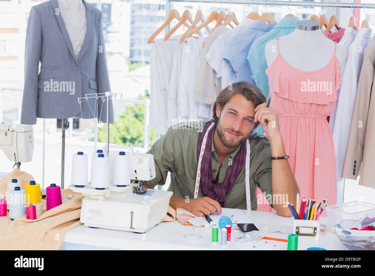 Thoughtful fashion designer Stock Photo - Alamy
