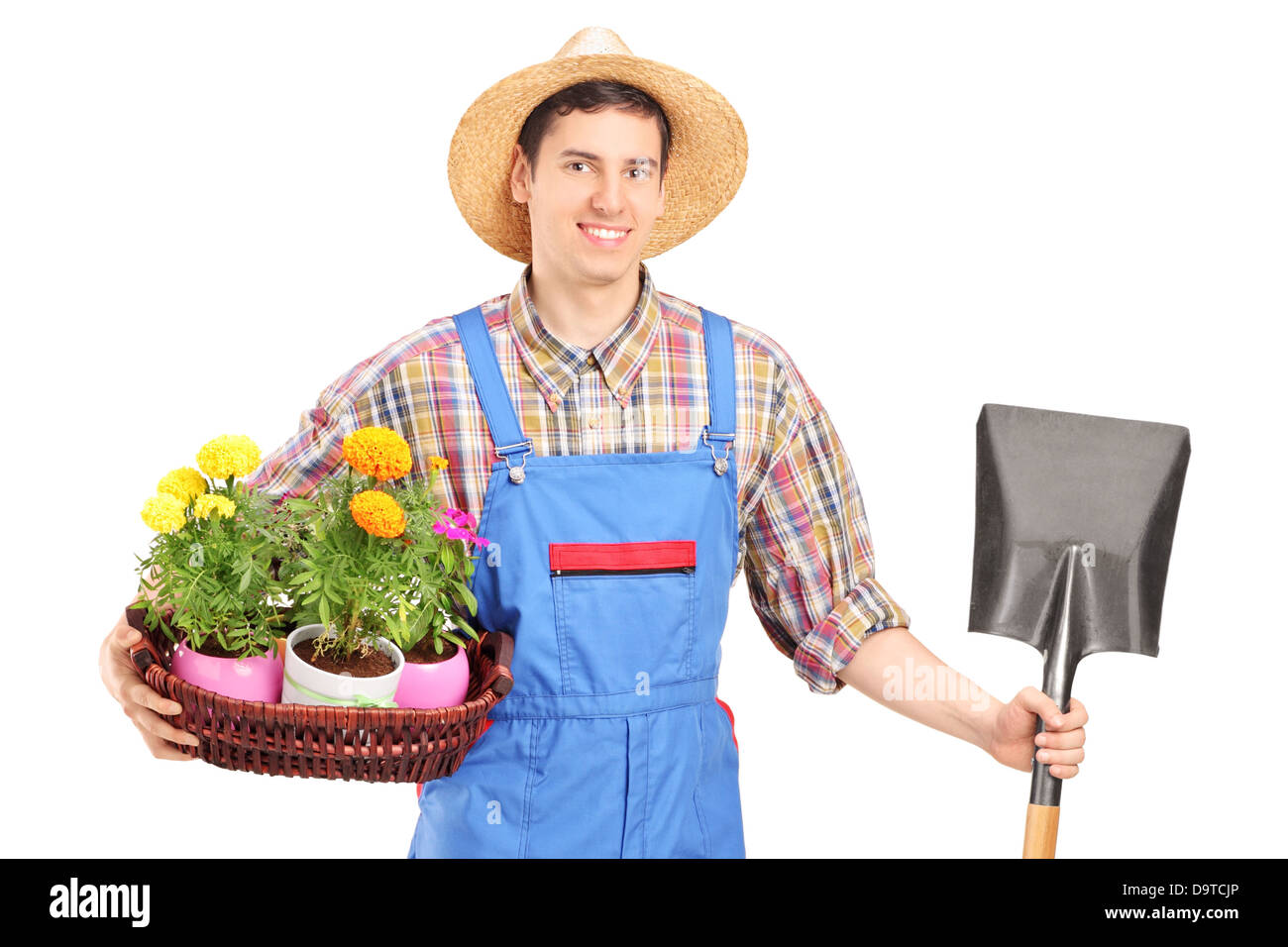 Male agricultural worker holding a shovel and flowers Stock Photo - Alamy