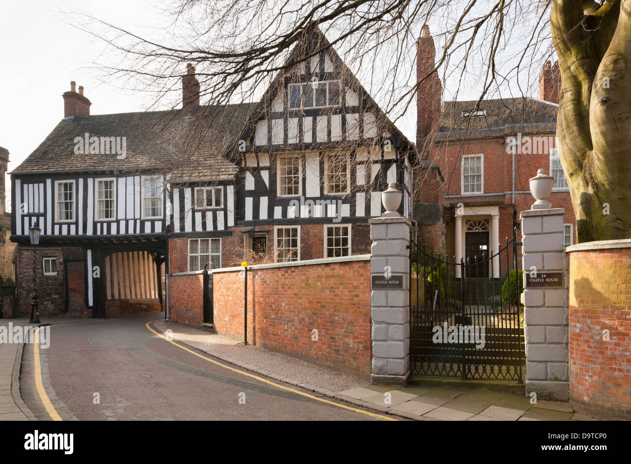 Castle House, Leicester, UK. Two Medieval half timbered buildings with a road passing underneath, and one Georgian building, now joined together. Stock Photo