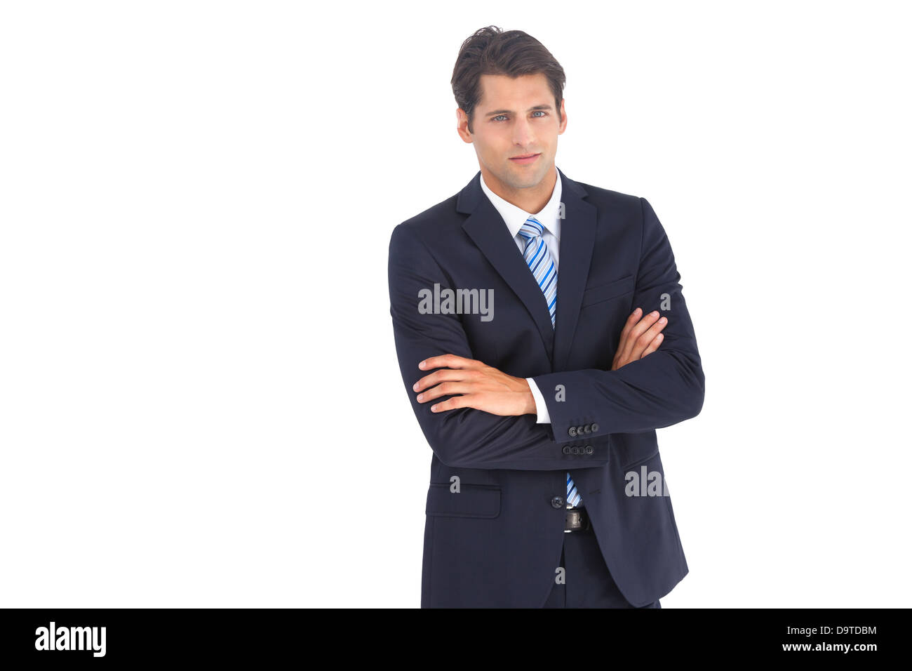 Serious businessman with crossed arms Stock Photo - Alamy