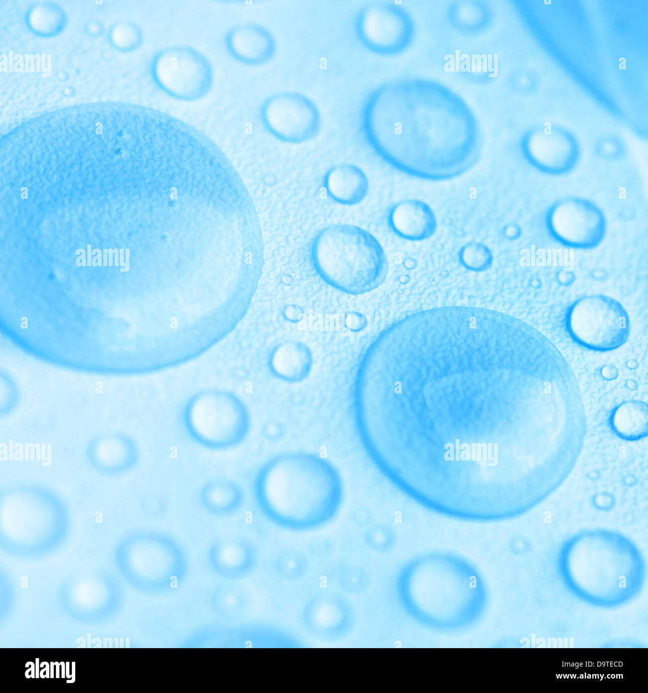 Blue Drops Of Water On The Textured Surface Stock Photo Alamy