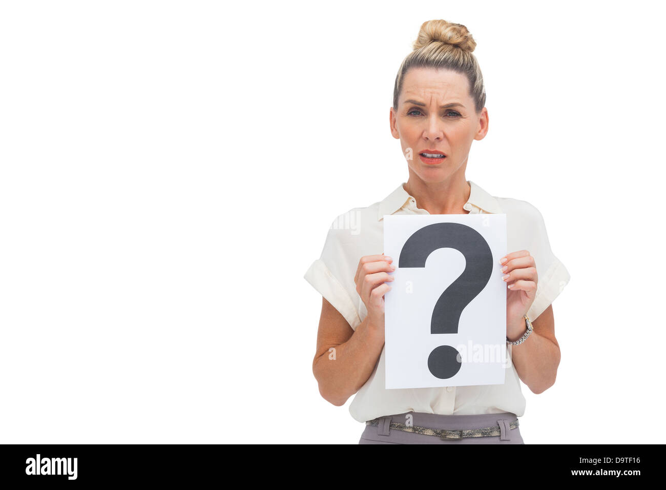 Uncertain businesswoman with question mark Stock Photo