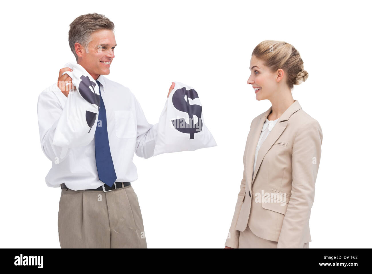 Smiling mature businessman showing money bags to his coworker Stock Photo