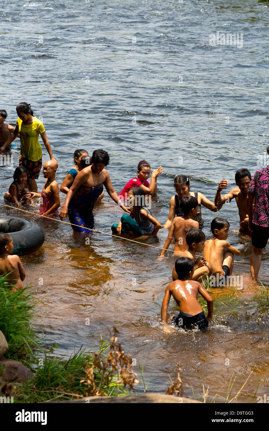 Local People taking a Bath in the River at the Teuk Chhou Rapids in the