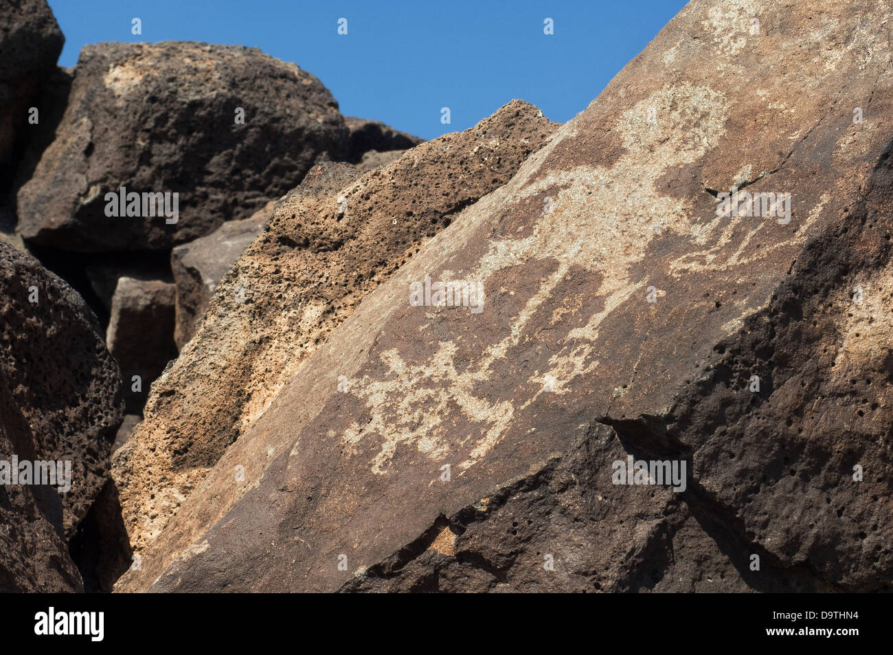 Native American petroglyphs on basalt, Petroglyph State Park, New Mexico. Digital photograph Stock Photo