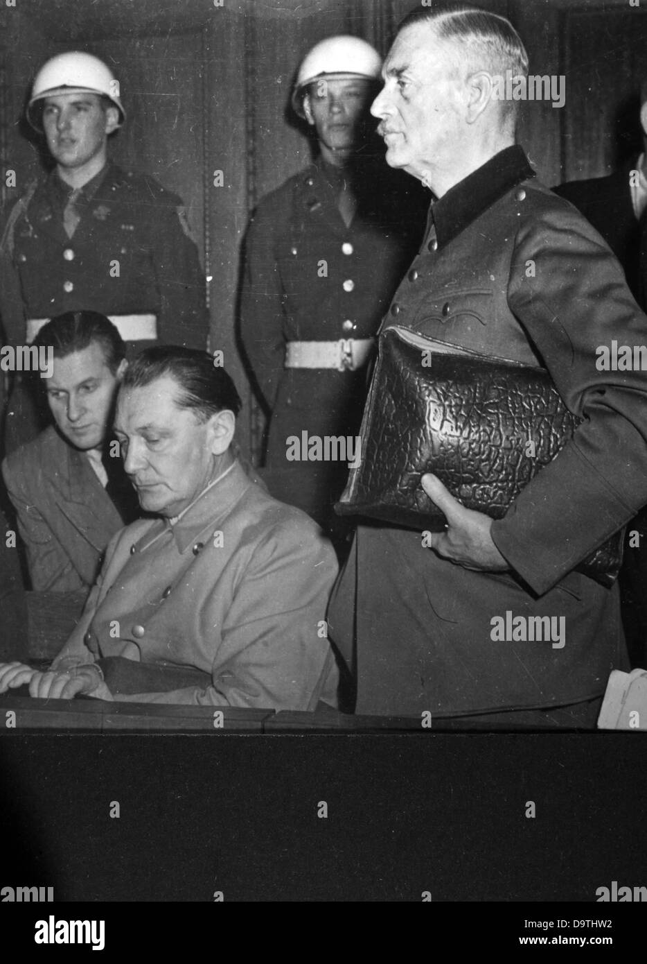 Nazi regime war criminals Hermann Göring and Wilhelm Keitel (standing) during the Nuremberg Trials in 1946 in front of the International Military Court of Justice.    Photo: Yevgeny Khaldei Stock Photo