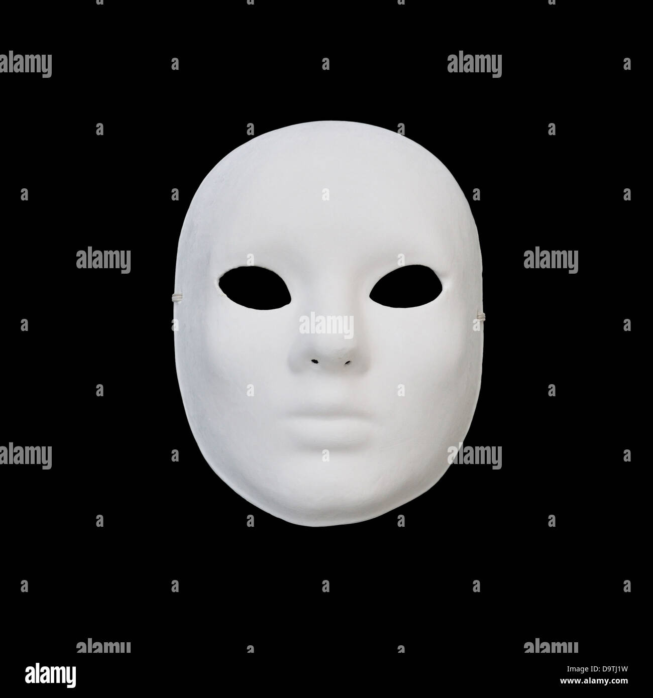 White mask with blank expression on black background Stock Photo Alamy