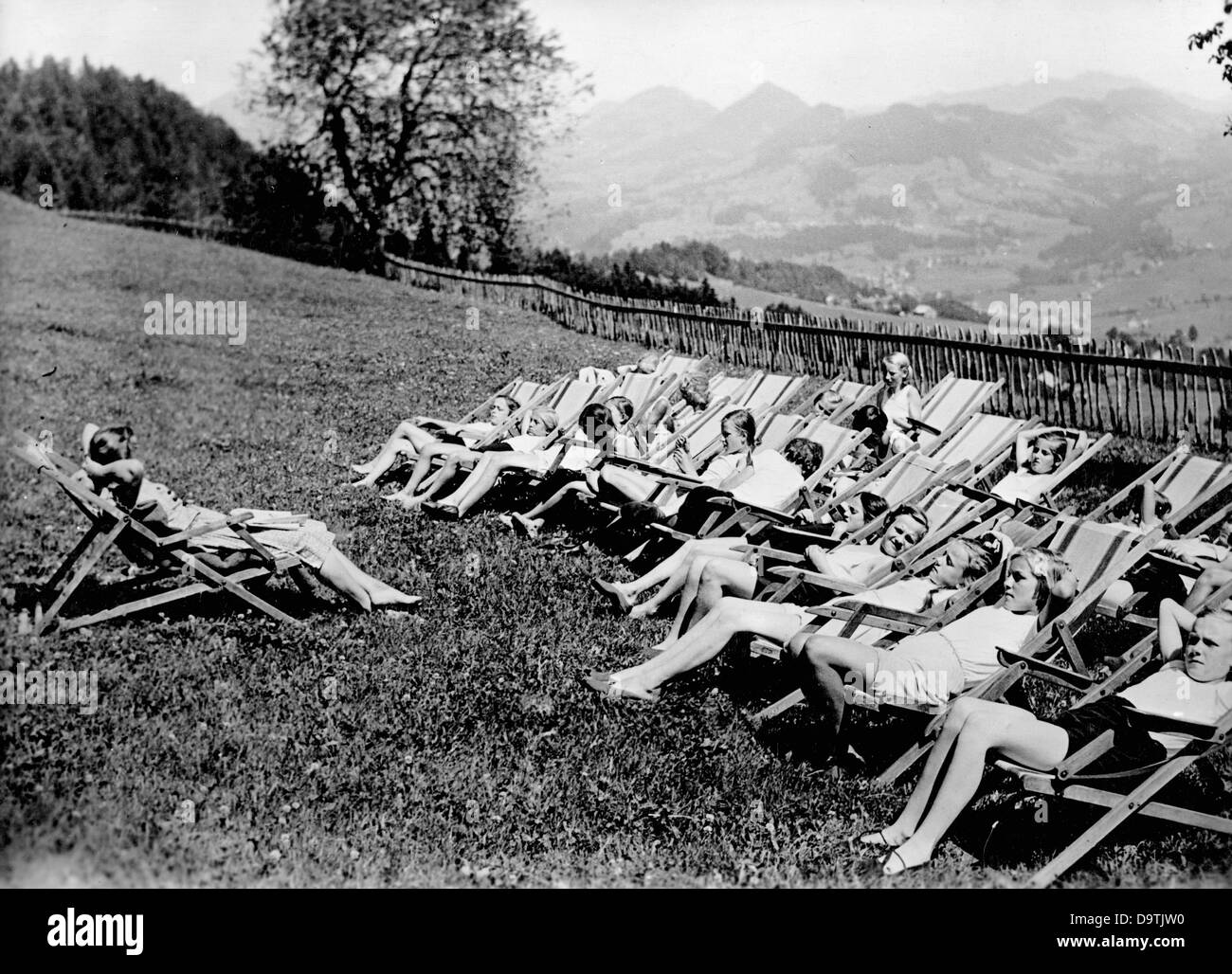 Girls are relaxing on deck chairs in a Children's Evacuation Program camps of the National Socialist People's Welfare, in April 1943. Fotoarchiv für Zeitgeschichte Stock Photo