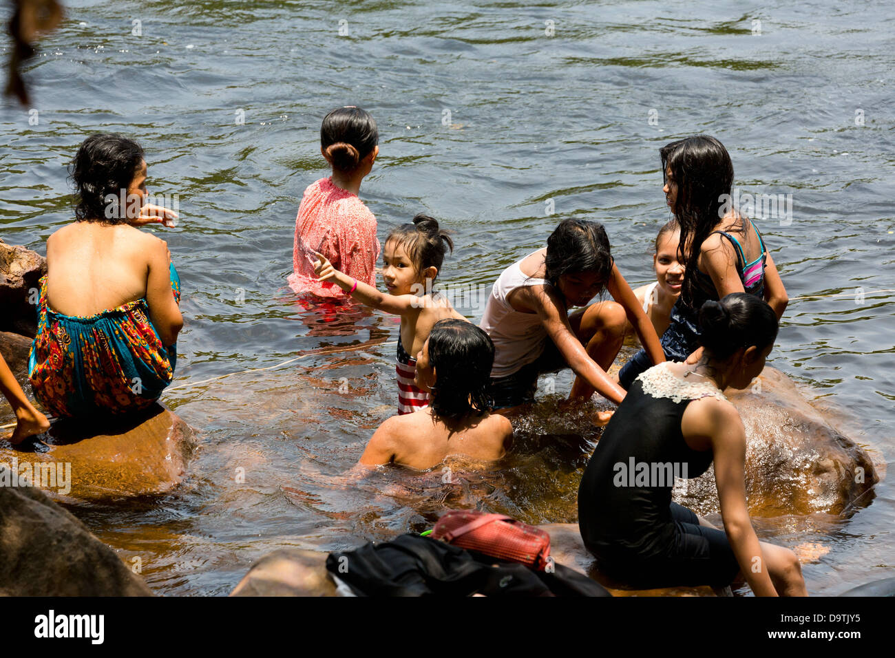 Local People taking a Bath in the River at the Teuk Chhou Rapids in the