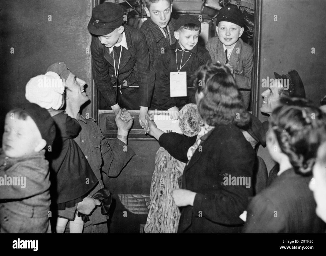 Mothers and fathers taking farewell of their children at a station in Berlin, before their departure to foster families in Denmark, in April 1943. Fotoarchiv für Zeitgeschichte Stock Photo