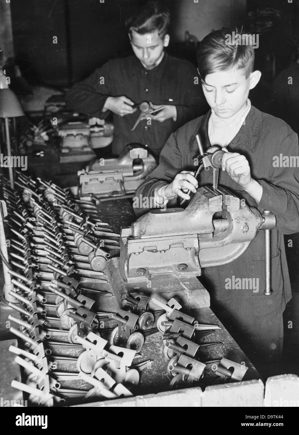 Hitler Youth boys are producing toys for soldier children for the Hitler Youth wartime service, in November 1942, at a factory of Siemens & Halske-Werke. Photo: Berliner Veralg/Archiv Stock Photo