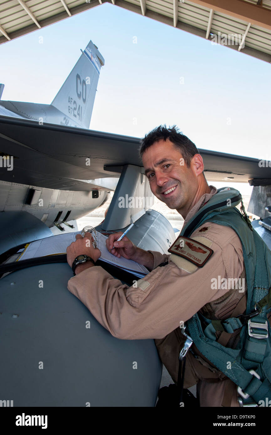 Major Christopher Southard, a pilot with the Colorado Air National Guard, completes his post-flight checklist after arriving at Stock Photo