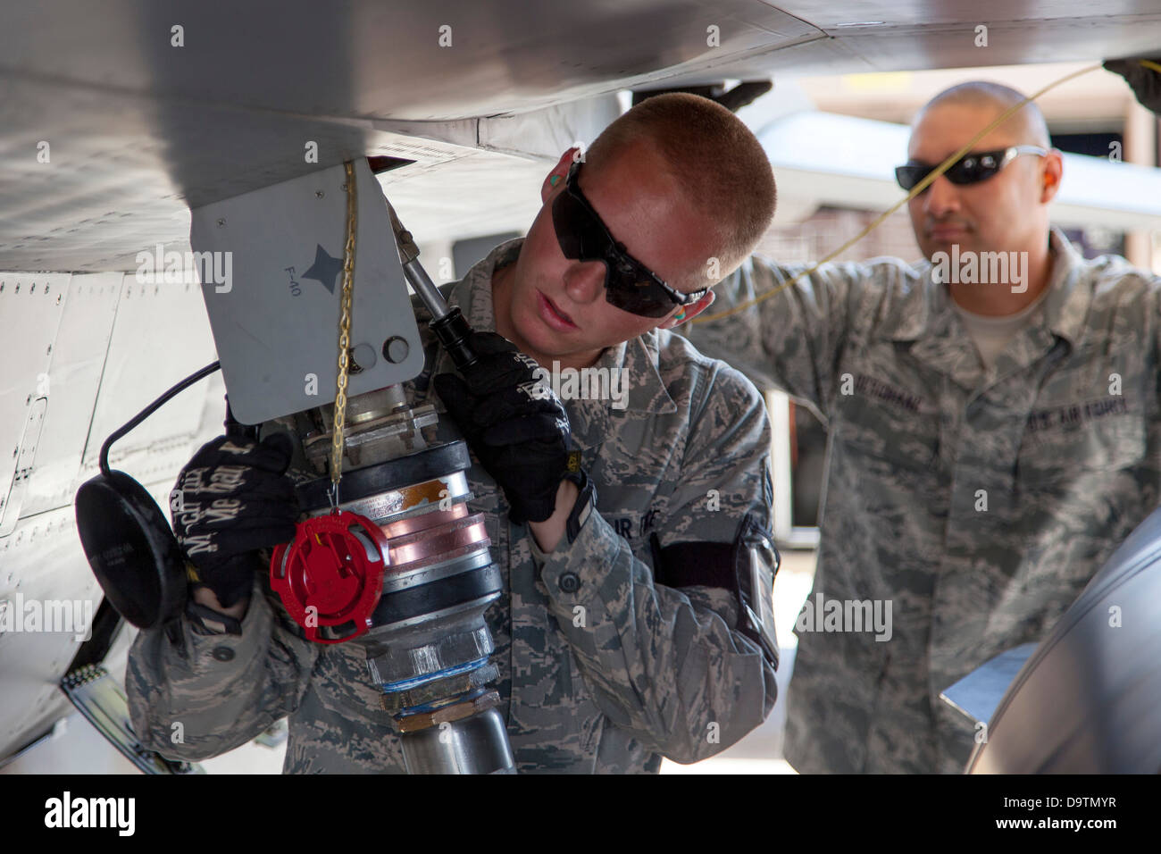 Senior Airman Brandon Olson from the 140th Wing, Colorado Air National Guard, fuels an F-16 aircraft located at a training base Stock Photo