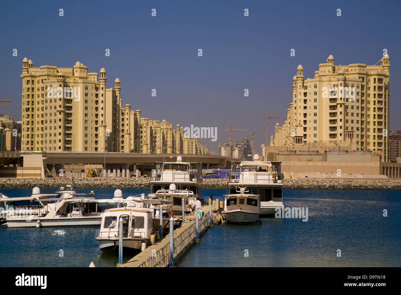 Boats front massive buildings in Dubai, U.A.E. Stock Photo