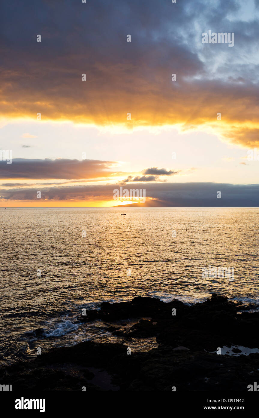 Dramatic sunset over La Gomera seen from the west coast of Tenerife, Canary Islands, Spain, Stock Photo