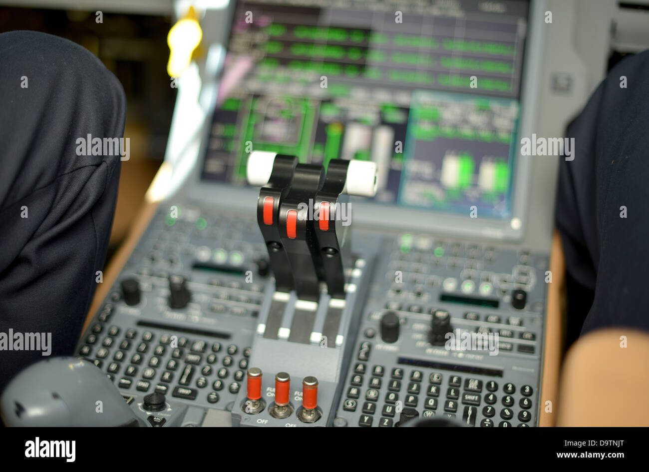 throttle levers in control panel in the cockpit of a jet plane Stock Photo