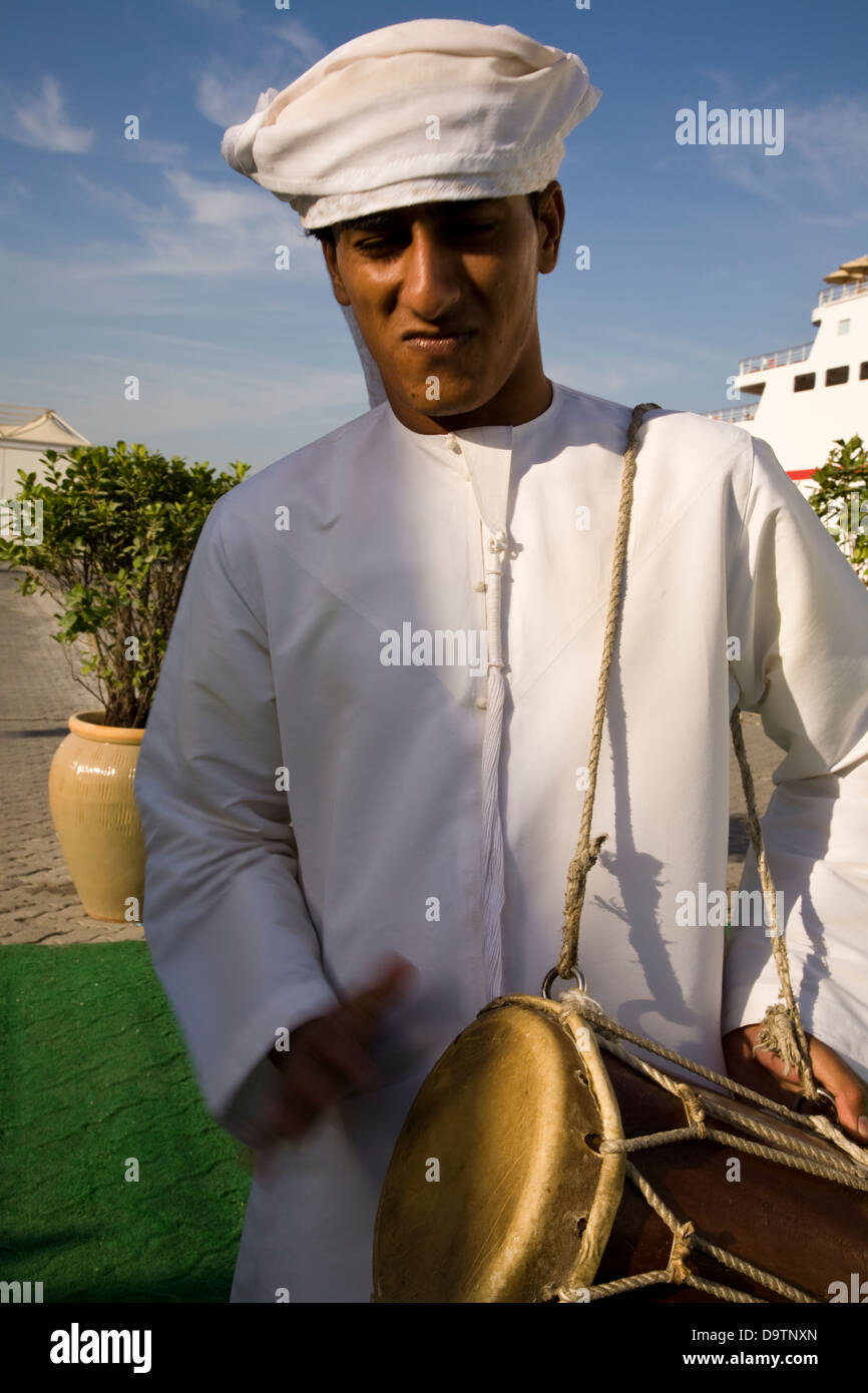 Arabic dance greeting to celebrate the arrival of the cruise ship MS Deutschland, at the port of Dubai, U.A.E. Stock Photo