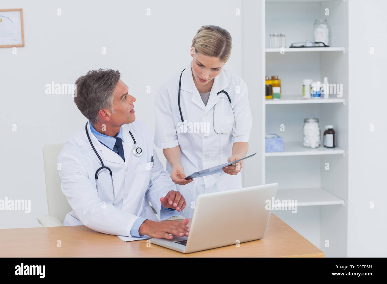 Nurse showing document doctor hi-res stock photography and images - Alamy