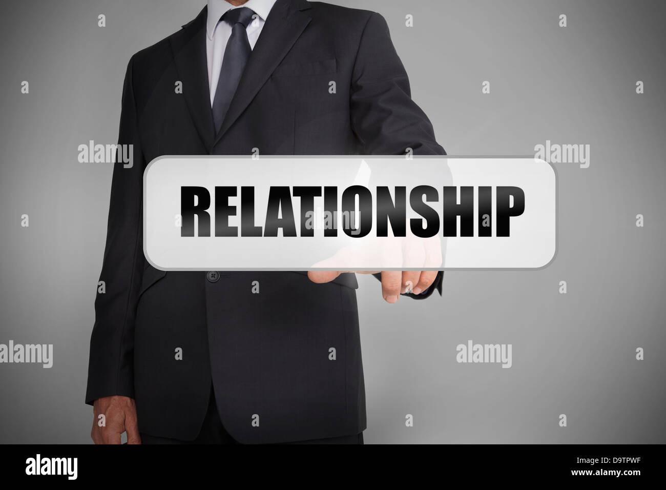 Businessman selecting the word relationship Stock Photo
