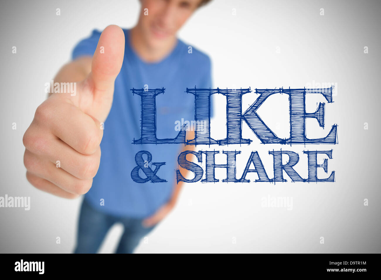Boy giving thumb up for like and share Stock Photo