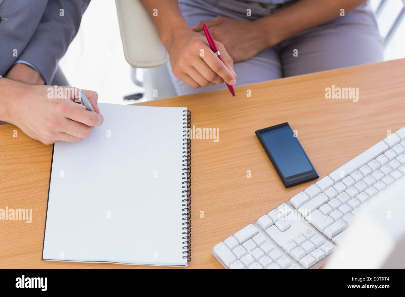 Business people working with notepad Stock Photo