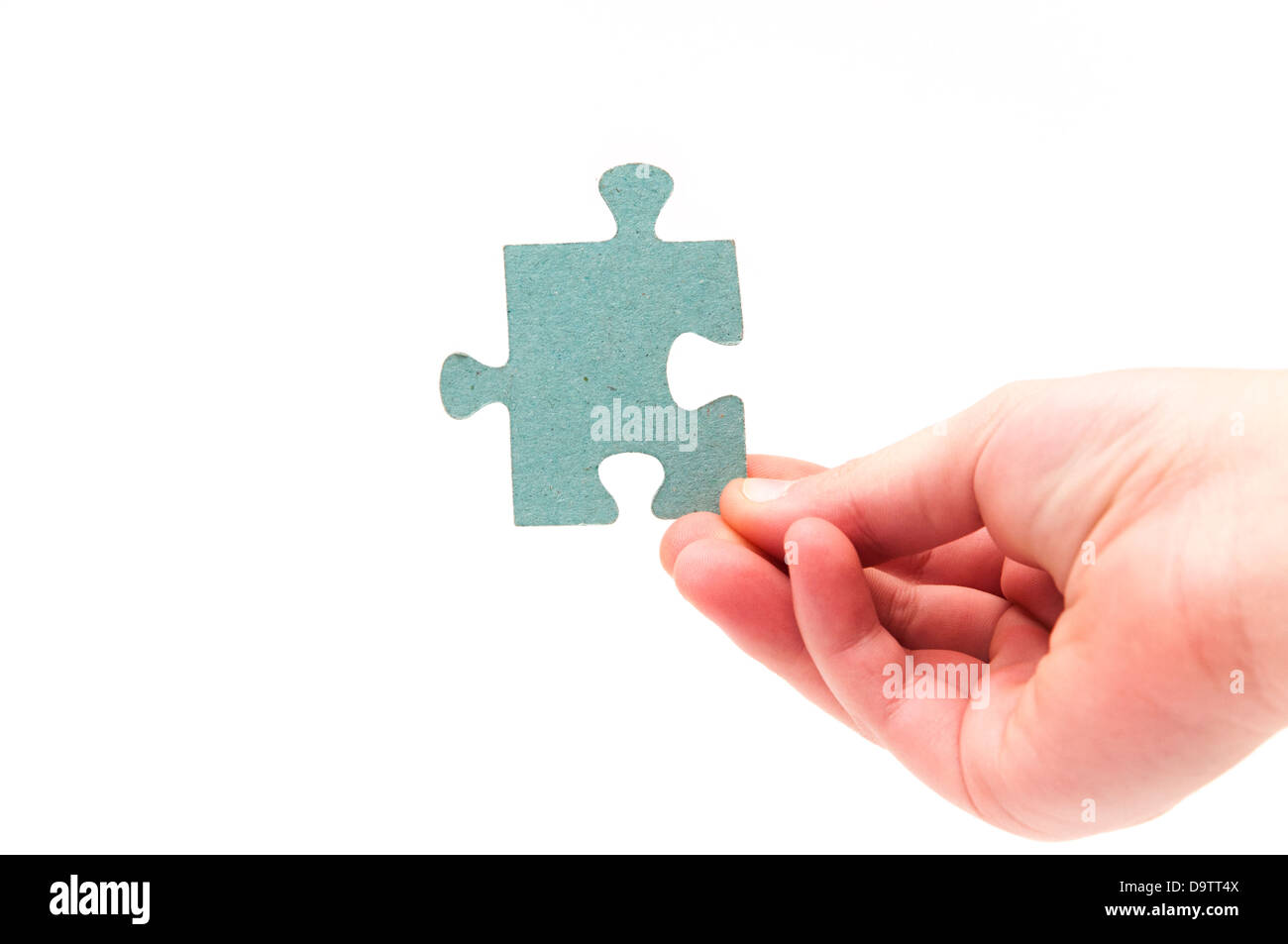 hands holding a puzzle piece on a white background Stock Photo - Alamy