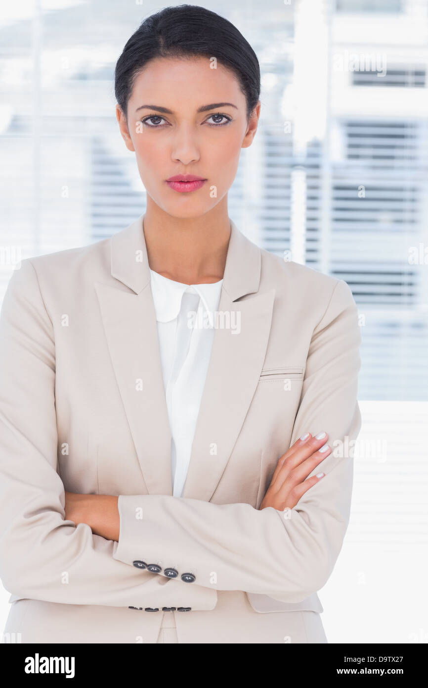 Serious businesswoman with arms crossed Stock Photo - Alamy