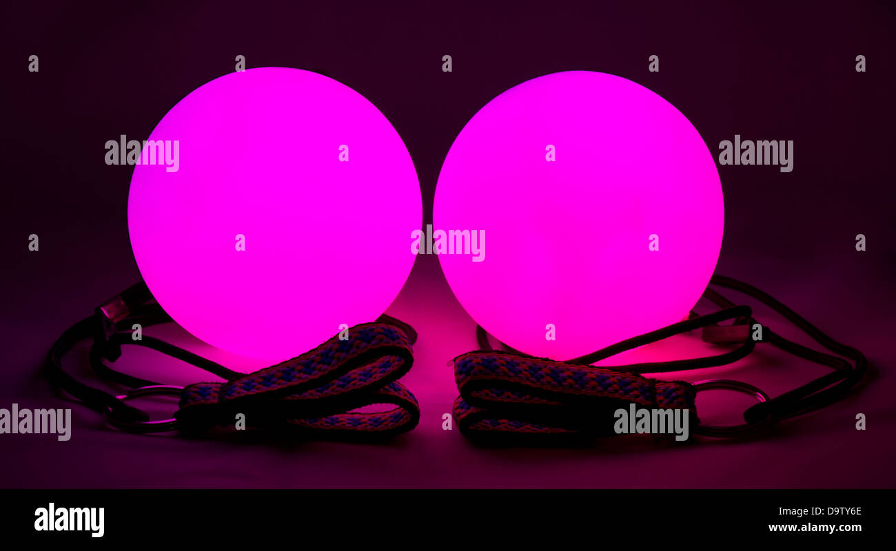 equipment for juggling - red luminous poi balls Stock Photo