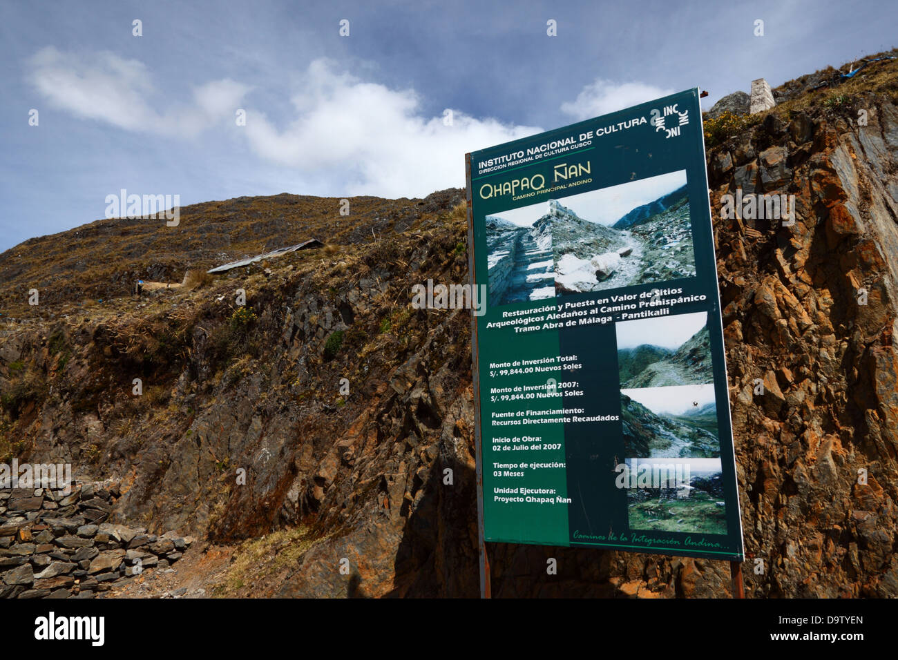 Sign with details about Qhapaq Ñan / Inca road restoration project and financing at Abra Malaga Pass, near Ollantaytambo, Peru Stock Photo