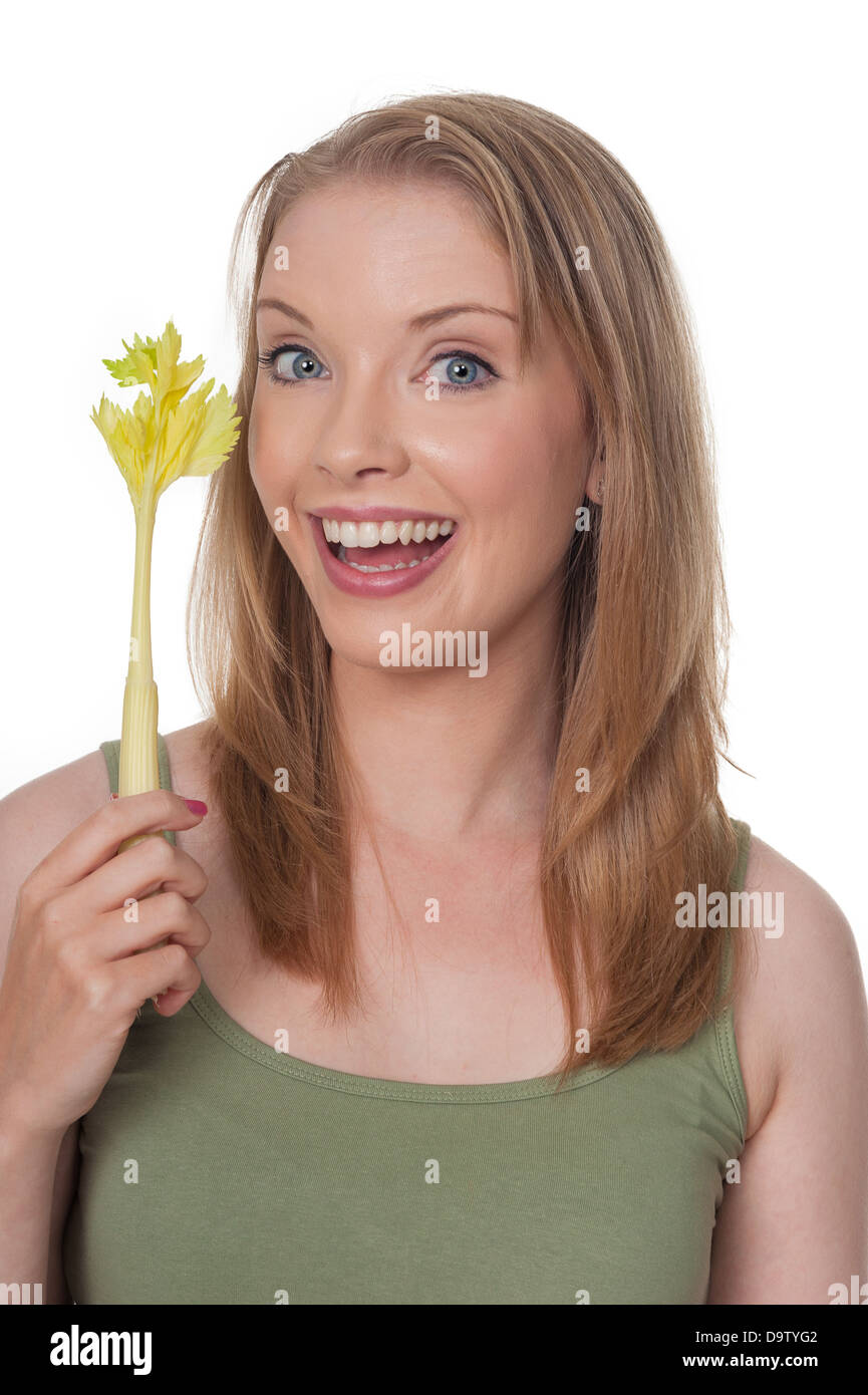 Happy young woman with celery stick - diet concept, isolated on white Stock Photo