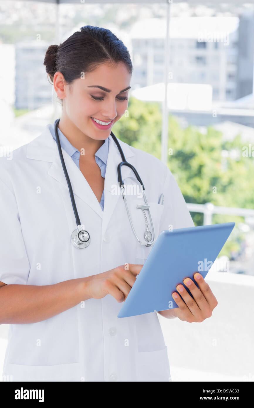Young happy woman doctor using hi-res stock photography and images - Alamy