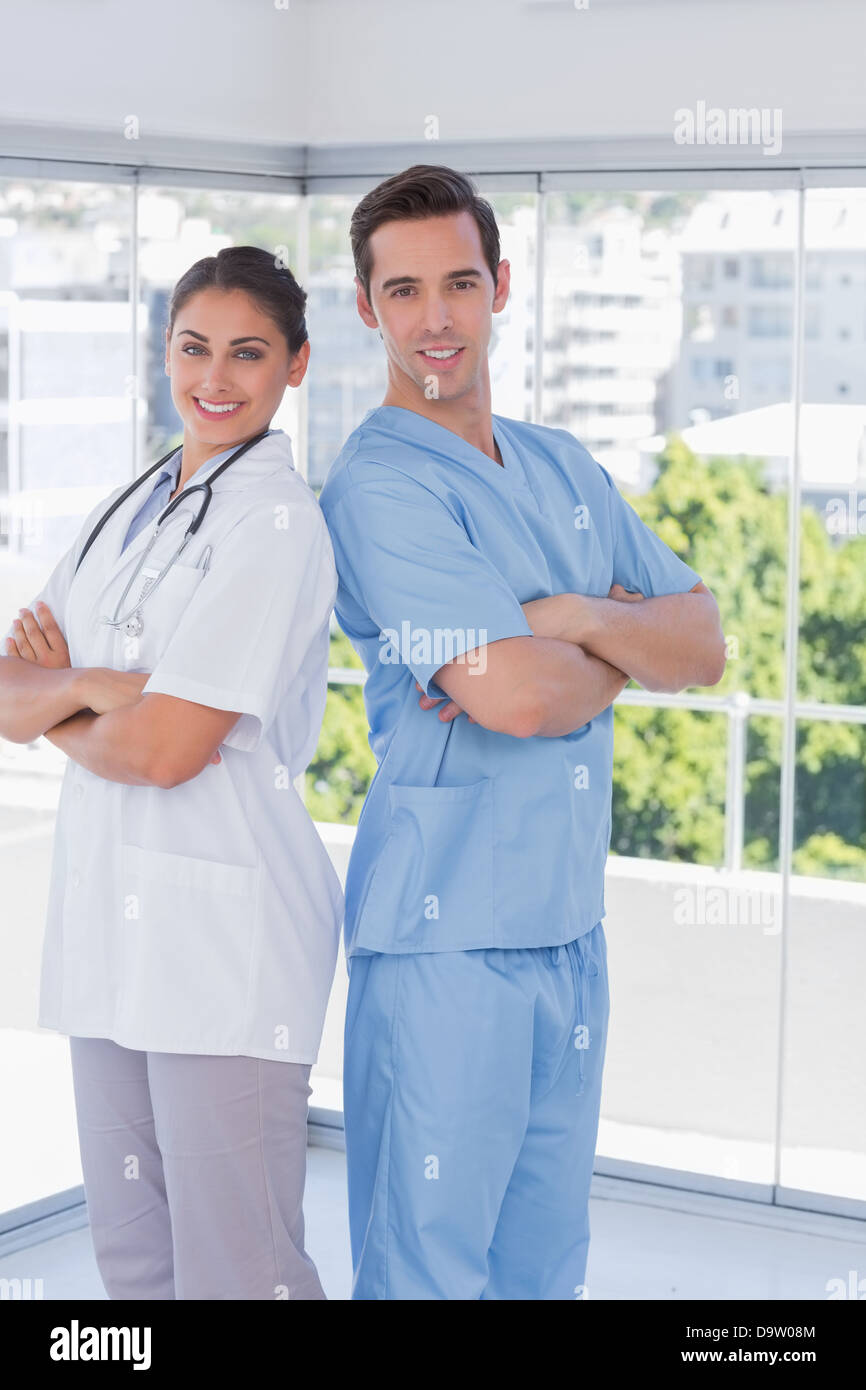 Medical staff standing with arms folded Stock Photo