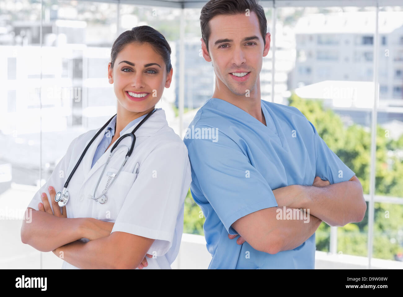 Medical staff standing with arms crossed Stock Photo