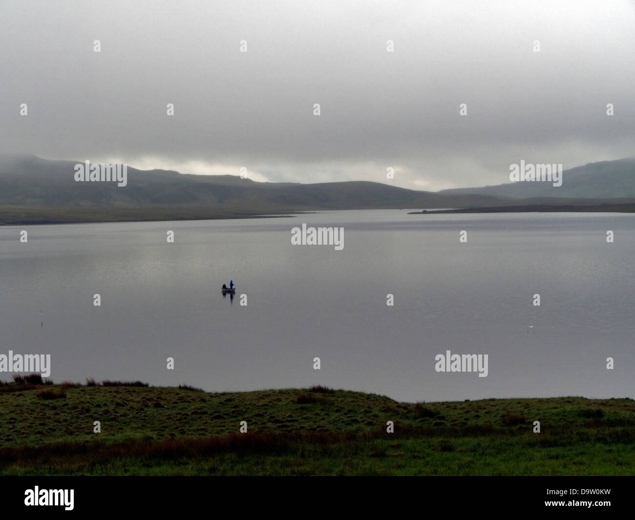 Fly fishing for trout on Loch Leathan, Isle of Skye, Scotland, UK Stock Photo
