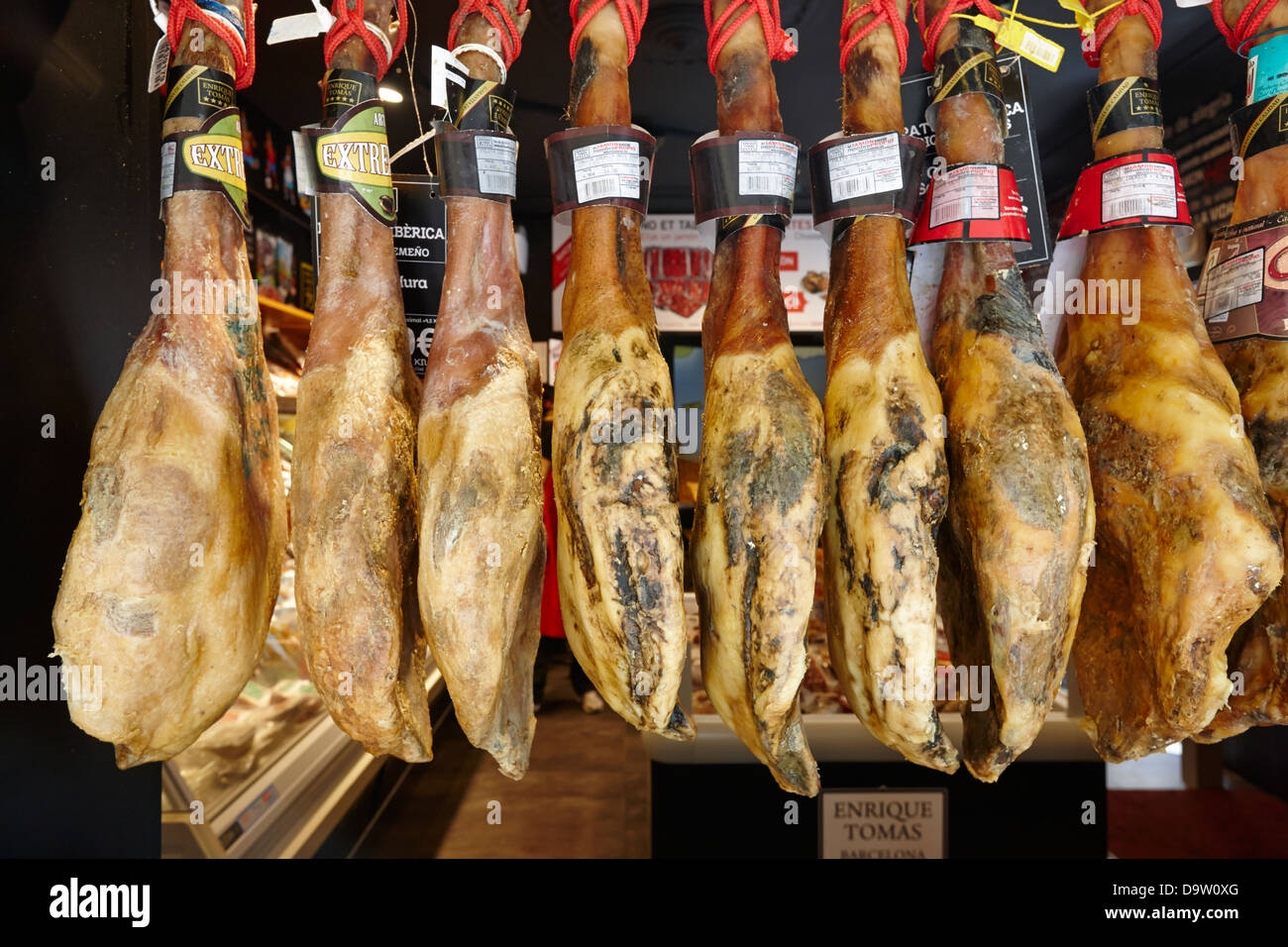 jamon iberico cured spanish hams hanging in a shop window in barcelona