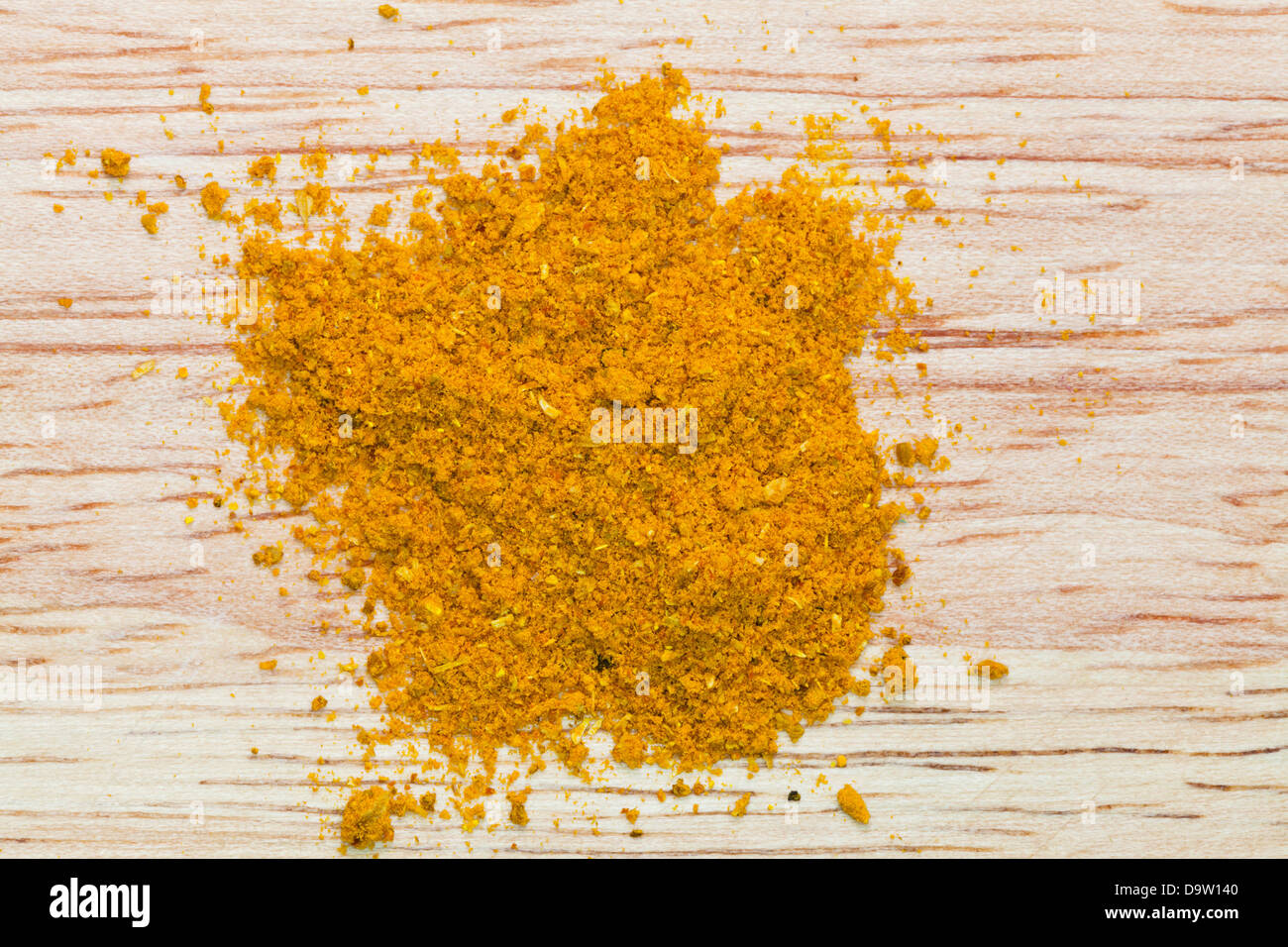 curry powder pinch on wooden board Stock Photo