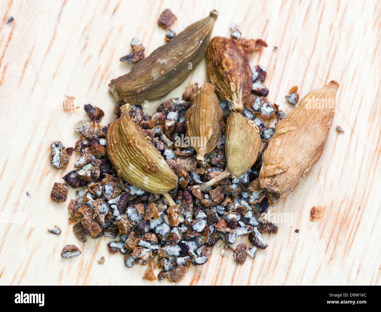 dried seeds and ground cardamon spice close up Stock Photo