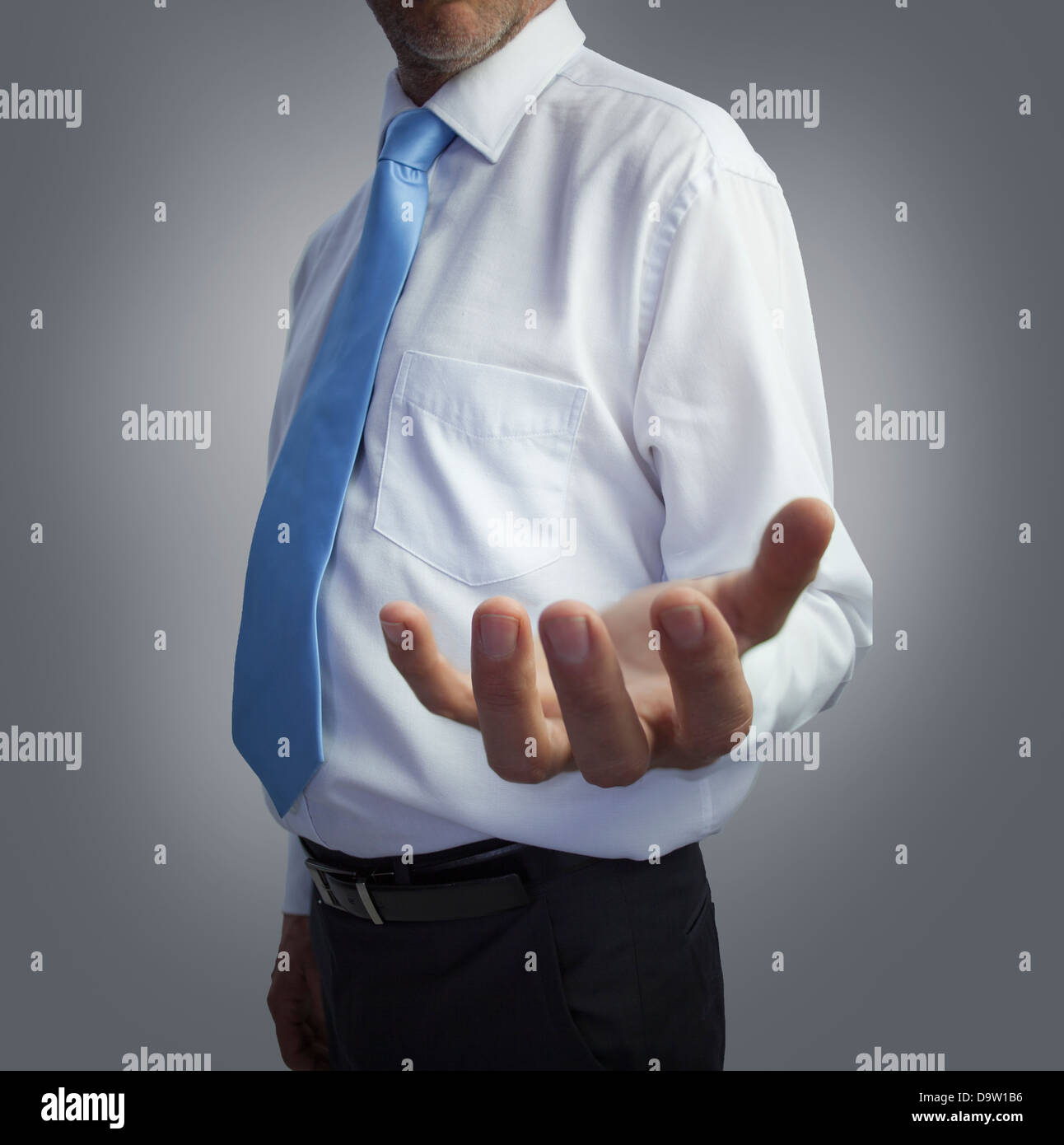 Businessman presenting his empty hand Stock Photo