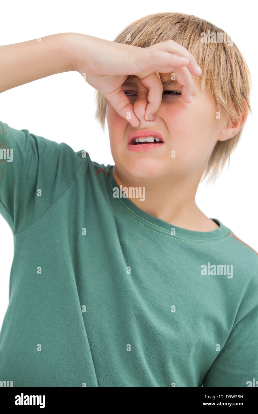 Boy pinching his nose Stock Photo