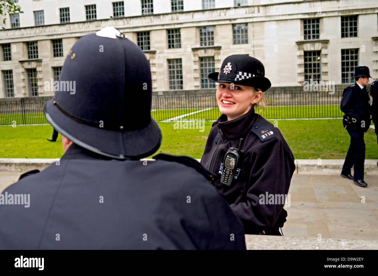 Smiling British policewoman on duty in Whitehall. Stock Photo
