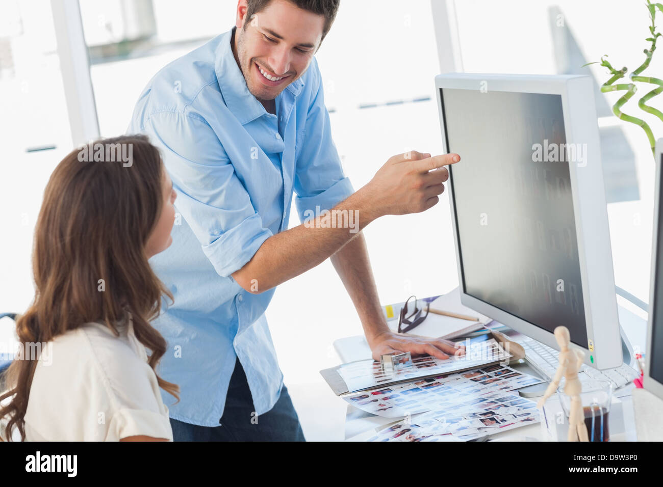 Photo editors working together on pictures Stock Photo - Alamy