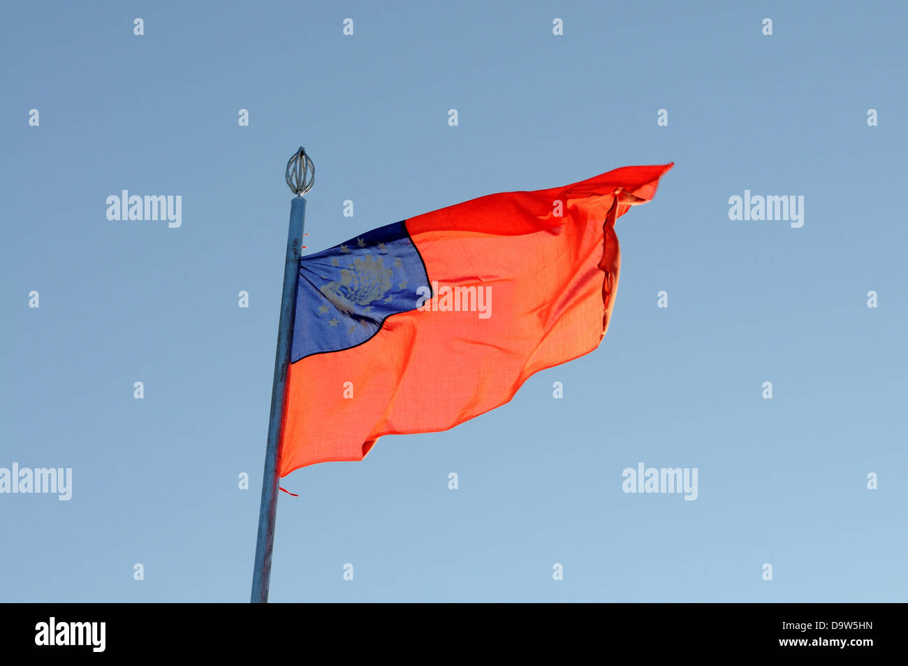 Flag of Myanmar fluttering, Kyaikto, Mon State, Myanmar Stock Photo