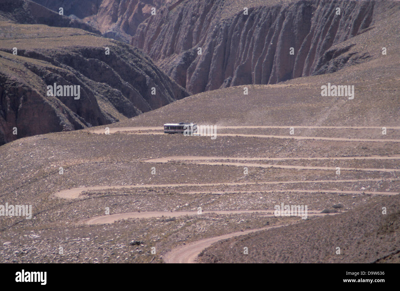 Bus on a dirt road near the village of Iruya, Salta Province, Argentina Stock Photo