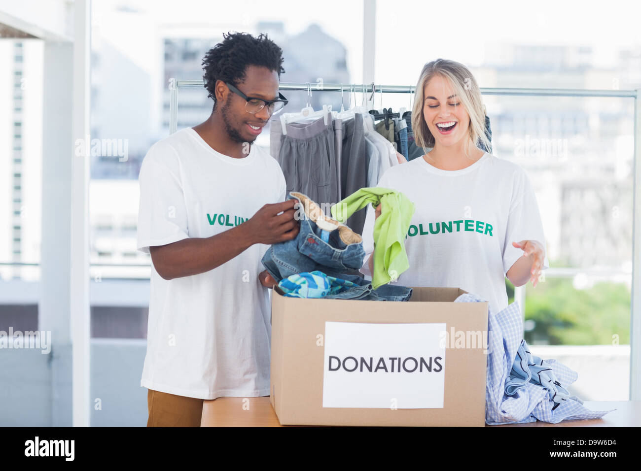 Black man woman volunteers talking hi-res stock photography and images ...