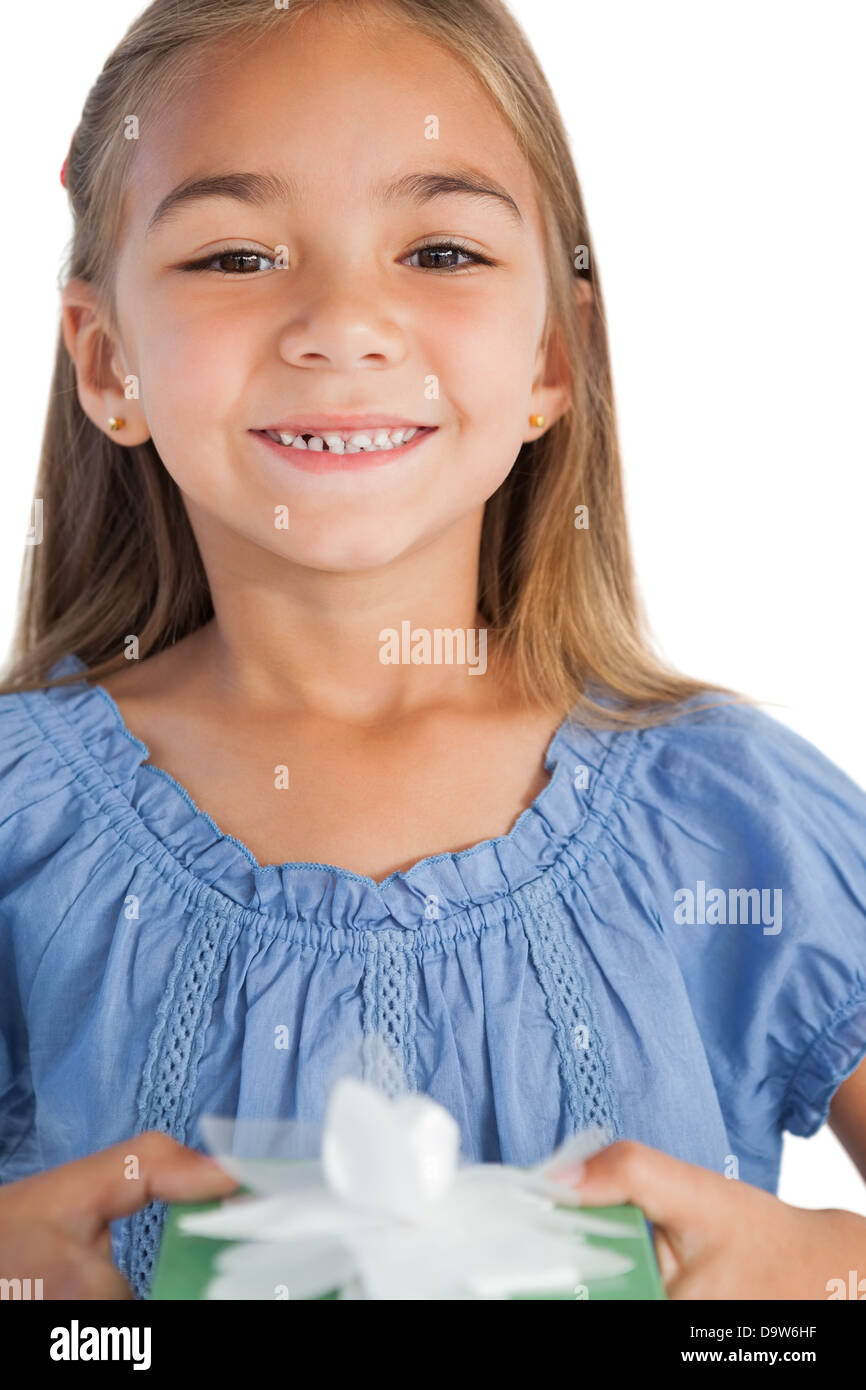 Smiling girl holding a present Stock Photo - Alamy