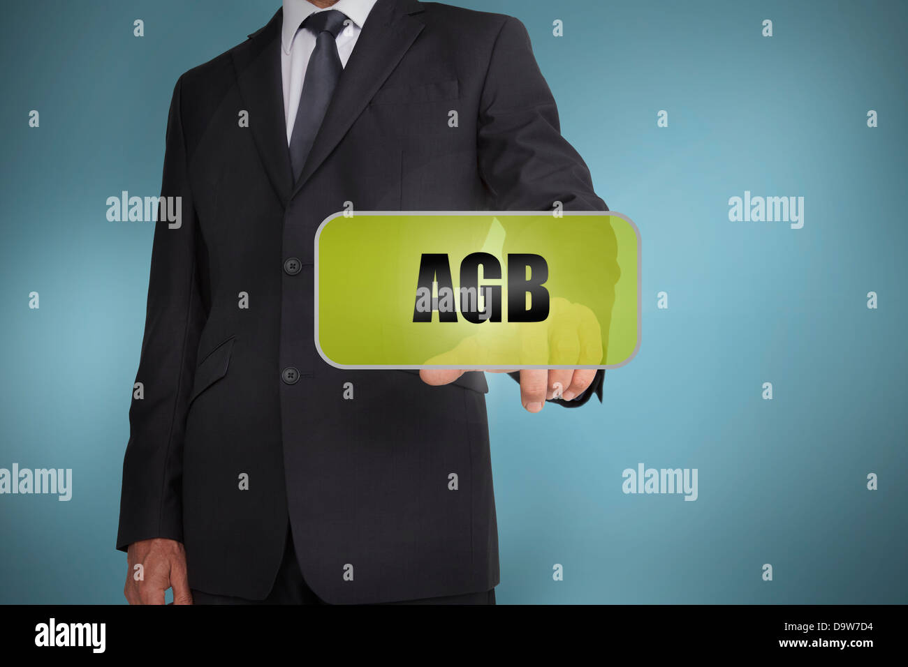 Businessman selecting green label with agb written on it Stock Photo