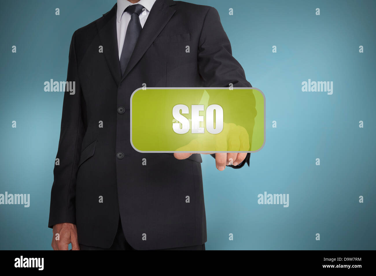 Businessman touching green tag with the word seo written on it Stock Photo