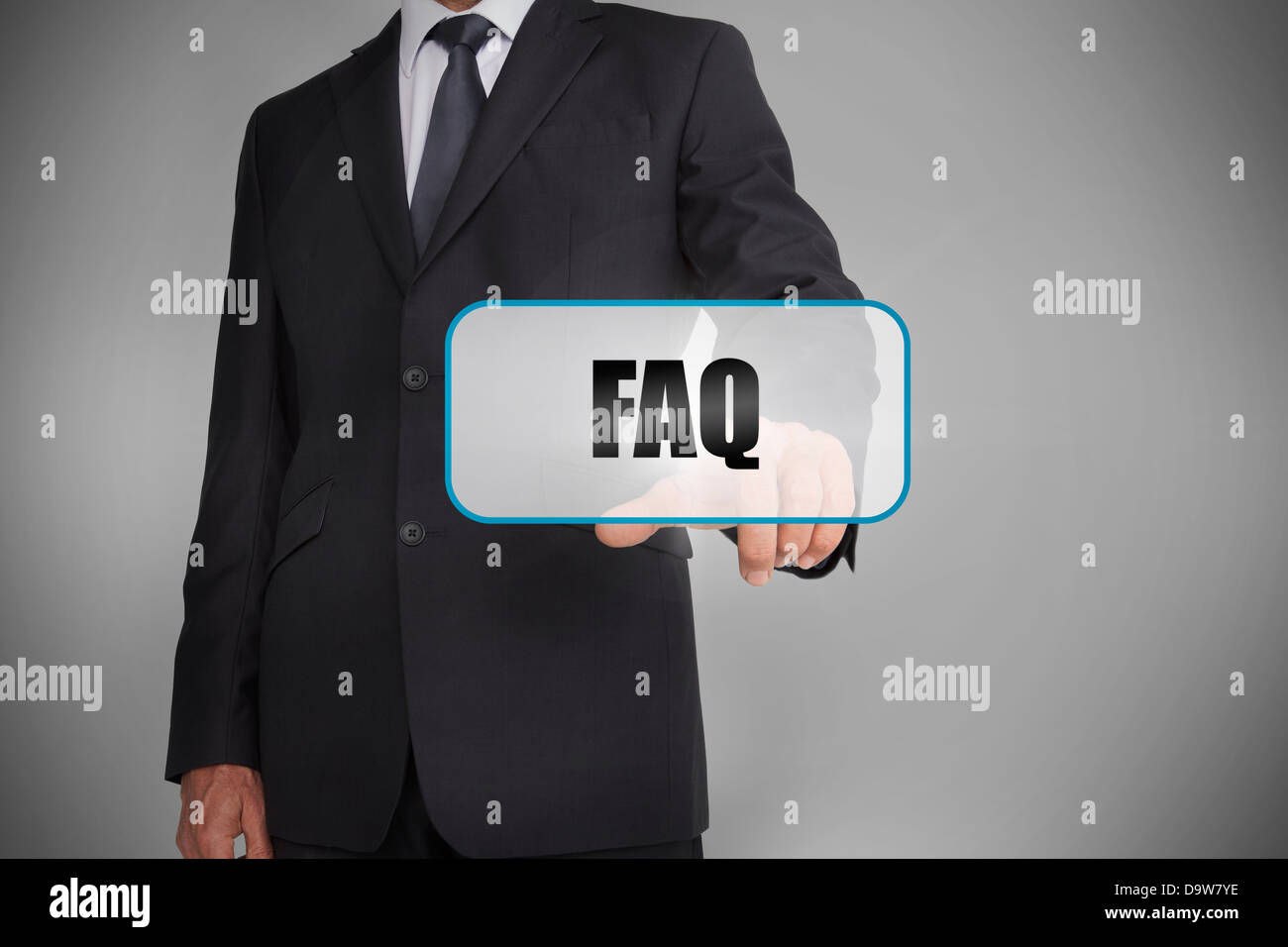 Businessman touching white tag with the word faq written on it Stock Photo