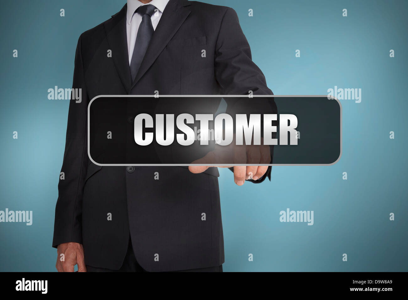 Businessman touching the word customer written on black tag Stock Photo