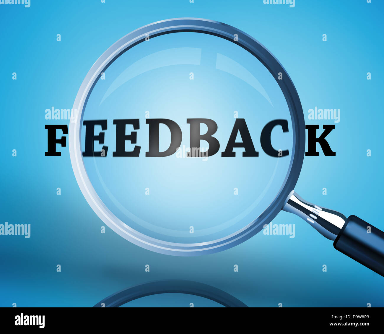 Magnifying glass showing feedback word Stock Photo